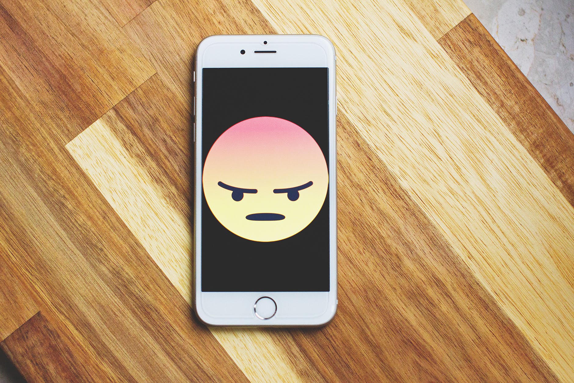 angry emoji on phone